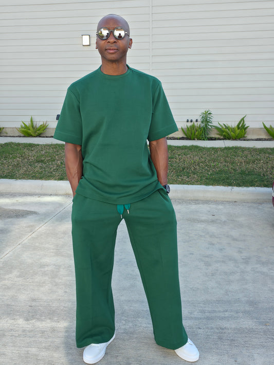 Forest emerald two-piece set featuring a boxy short-sleeved crewneck top and matching wide-leg trousers. -Front View