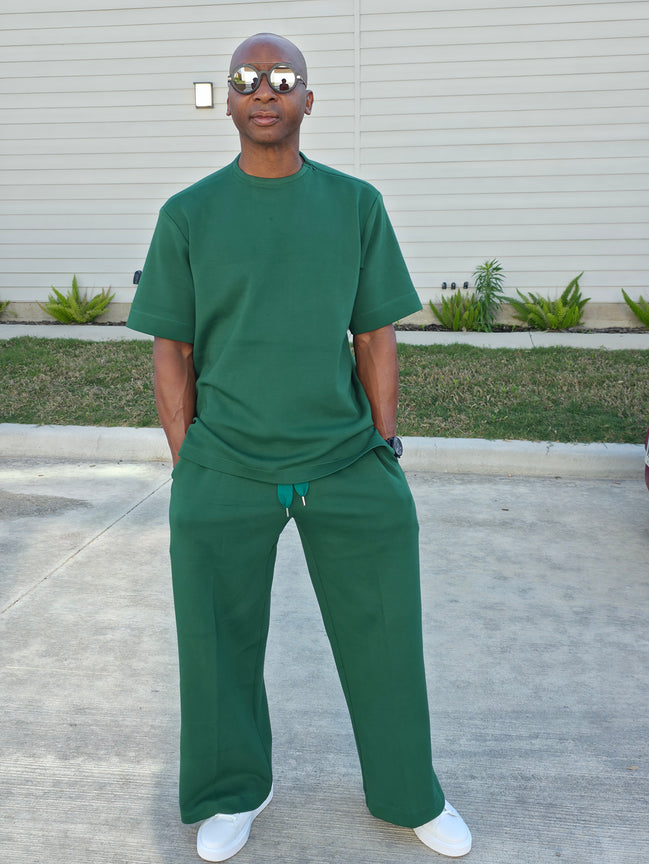 Forest emerald two-piece set featuring a boxy short-sleeved crewneck top and matching wide-leg trousers. -Front View