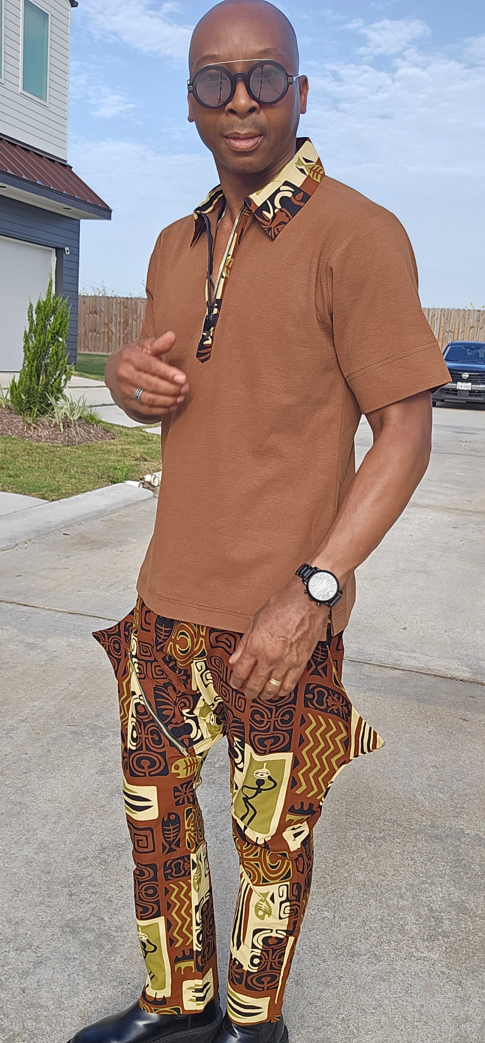 Two-Piece Set featuring a cognac brown short-sleeved polo with patterned collar trim and matching brown tribal print drop-crotch trousers.