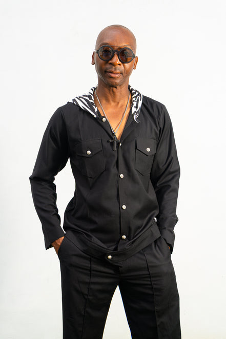 Two-Piece Set featuring a black hooded button-down shirt with zebra-print hood lining and matching black flared trousers with front-seam detailing.