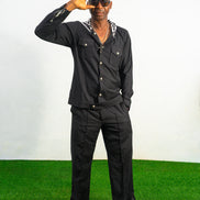 Two-Piece Set featuring a black hooded button-down shirt with zebra-print hood lining and matching black flared trousers with front-seam detailing.