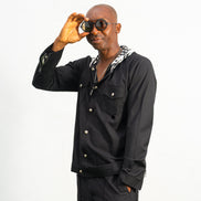 Two-Piece Set featuring a black hooded button-down shirt with zebra-print hood lining and matching black flared trousers with front-seam detailing.
