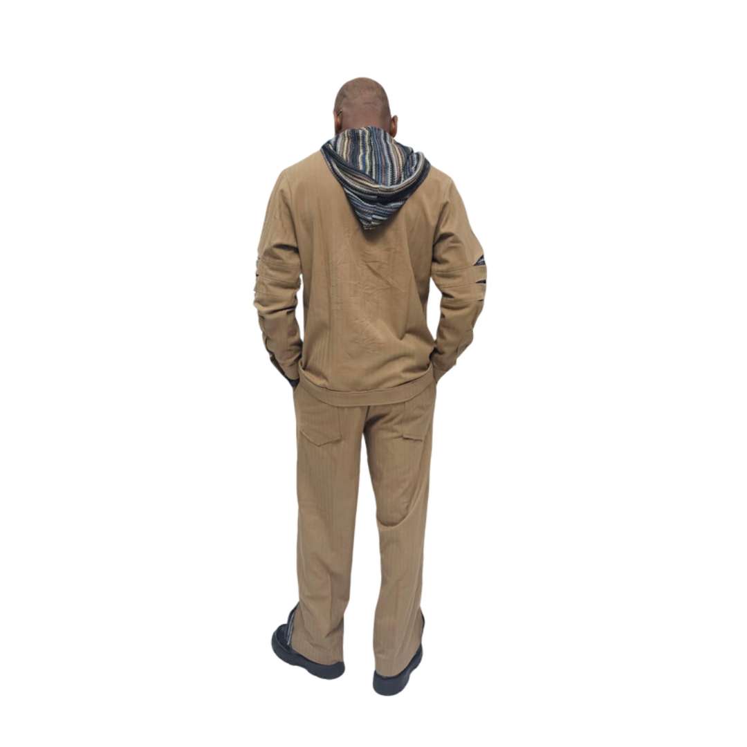 Two-Piece Set featuring a tan button-down shirt with a multicolored striped hoodie and arm cut-outs, paired with matching straight-leg trousers