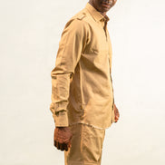 Two-Piece Set featuring a beige long-sleeved button-down shirt with shoulder epaulets and matching cargo-style trousers with side pockets.