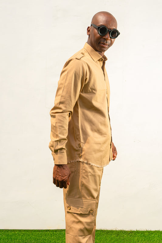Two-Piece Set featuring a beige long-sleeved button-down shirt with shoulder epaulets and matching cargo-style trousers with side pockets.