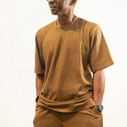 Two-Piece Set featuring a brown short-sleeved top and matching trousers in a textured weave with a simple crew neckline and relaxed silhouette.