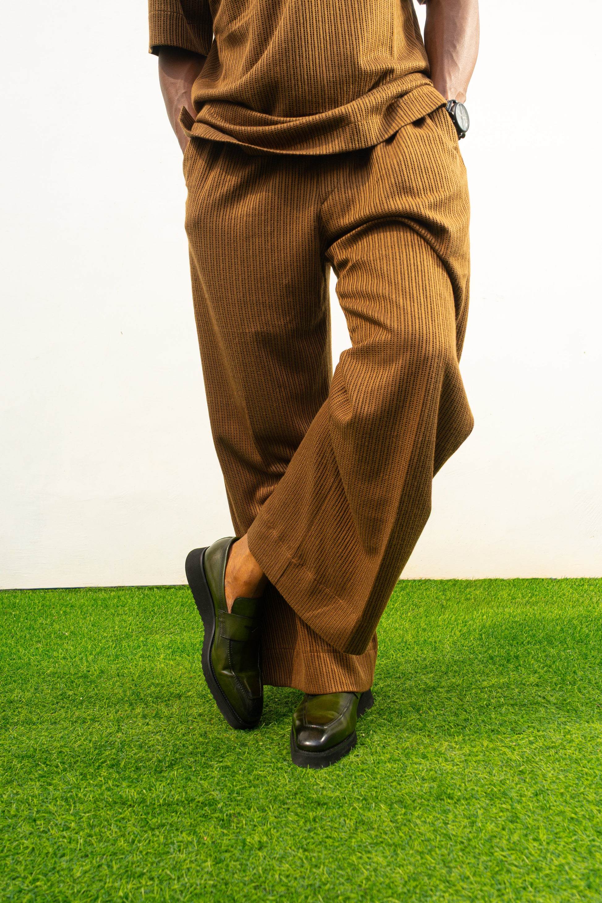 Two-Piece Set featuring a brown short-sleeved top and matching trousers in a textured weave with a simple crew neckline and relaxed silhouette. Bottoms View