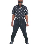 Urban Heritage short-sleeve utility jumpsuit featuring a black and white geometric -Front View
