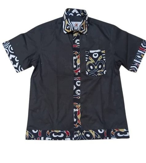 Black shirt with colorful geometric patterns on a white background