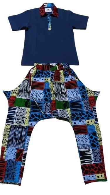 Children's outfit with a blue shirt and colorful patterned pants on a white background