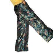 African Women's Pants featuring high-waisted, wide-leg trousers crafted from a dark, metallic floral jacquard damask fabric