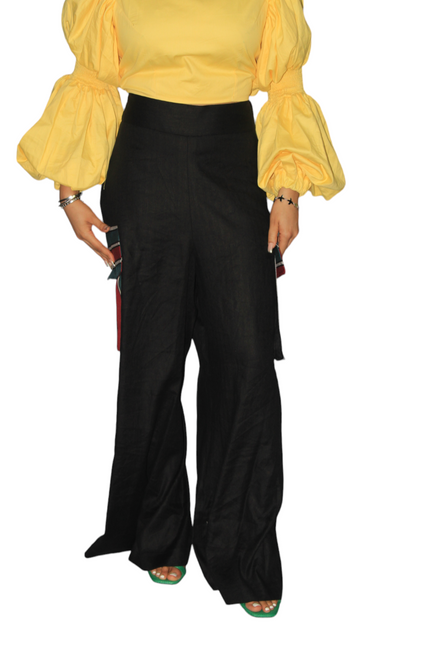 African Women's Pants featuring a high-waisted black wide-leg silhouette with distinct multi-colored striped Aso Oke side patch pockets